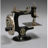 A child's toy Singer sewing machine by Dinger Manfg. Co