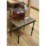 A copper kettle and a waiter