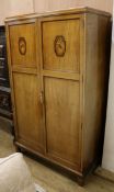 An Art Deco walnut and marquetry wardrobe, probably by Bath Cabinet Makers W.107cm