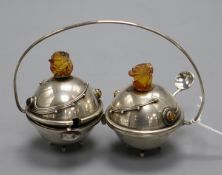 A Polish 925 white metal and amber set double condiment stand with two spoons, width 12.4cm.