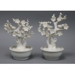 A pair of Chinese blanc de Chine models of birds in prunus trees