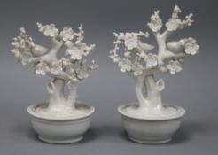 A pair of Chinese blanc de Chine models of birds in prunus trees