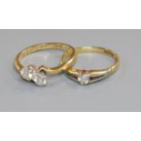 A 15ct gold and diamond solitaire ring and an 18ct two-stone diamond crossover ring