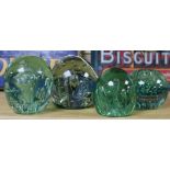 Four bubble inclusion glass 'dump' paperweights, one an inkwell