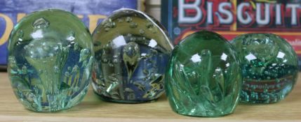 Four bubble inclusion glass 'dump' paperweights, one an inkwell