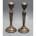 A modern pair of silver candlesticks, A.T. Cannon Ltd, Birmingham, 1972, weighted, 23.2cm.