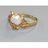 An early 20th century Art Nouveau 18ct gold and heart shaped baroque cultured? pearl set ring,