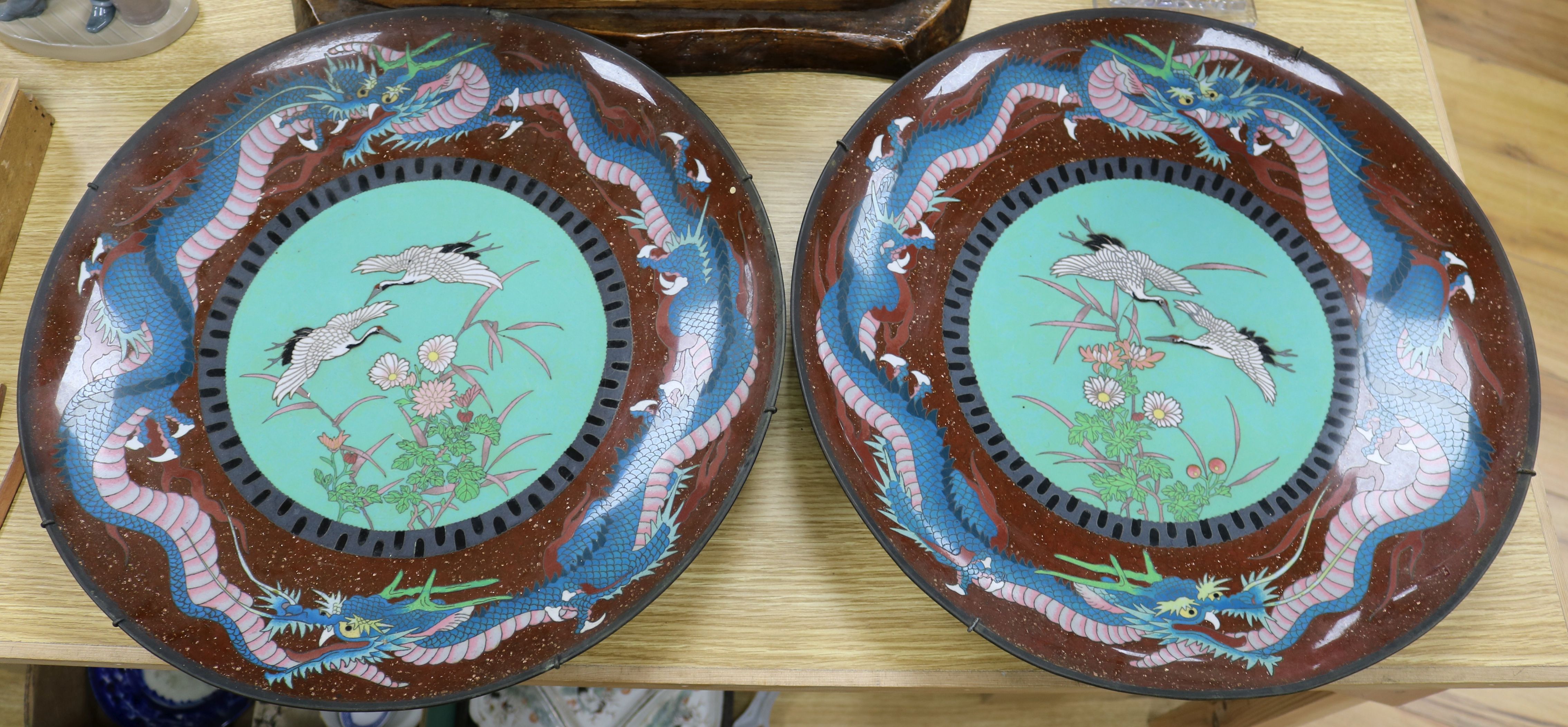 A pair of Japanese cloisonne enamel 'dragon' chargers diameter 45cm