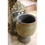 A Dutch brass urn and cast brass mirror Mirror W.45cm, Pot W.42cm