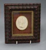 A Grand Tour plaster double portrait medallion, framed overall 16.5 x 15cm