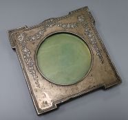 An Edwardian repousse silver photograph frame by William Hutton & Sons, Birmingham, 1906, 18cm, (
