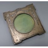 An Edwardian repousse silver photograph frame by William Hutton & Sons, Birmingham, 1906, 18cm, (