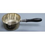 A 19th century French 955 standard white metal large brandy? pan, with ebonised handle, 33.8cm, 13.5