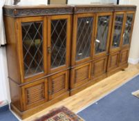 A pair of carved oak bookcases enclosed by leaded glazed doors and another 2 W.76cm and 89cm