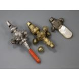A 19th century silver and coral child's rattle and whistle and two other rattles.