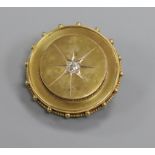A late Victorian yellow metal and diamond set circular brooch, 35mm.