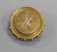 A late Victorian yellow metal and diamond set circular brooch, 35mm.