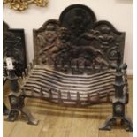 A cast iron fire-back, decorated with a lion rampant, together with a fire-back and fire dogs Basket