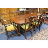 A late Victorian extending dining table, with two leaves and a set of six dining chairs W.193cm