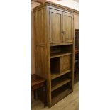 A late Victorian oak cupboard, fitted door and drawers W.100cm