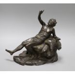 A bronze of a reclining man height 24cm