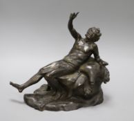 A bronze of a reclining man height 24cm