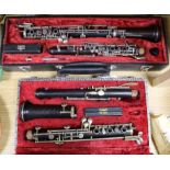 A Noblet cased oboe and another similar oboe