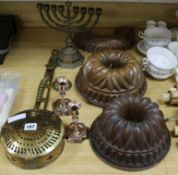 A quantity of brass and copper including a pair of candlesticks, two jelly moulds, etc