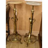 A pair of telescopic brass stands Width of base 38cm