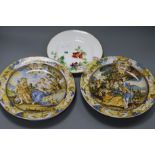 A pair of majolica plates and another