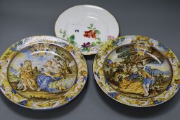 A pair of majolica plates and another