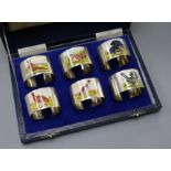 A modern cased set of six silver and enamel 'game bird' napkin rings, W.I. Broadway & Co,