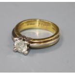 A diamond solitaire ring, 18ct yellow and white gold shank, size N.