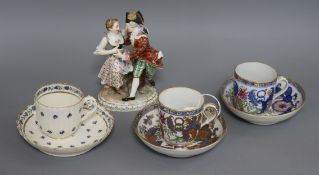 A small collection of cabinet porcelain, including a Meissen group of a dancing couple, possibly