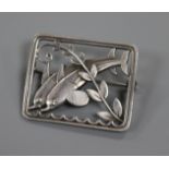 A Danish Georg Jensen sterling silver square brooch depiction twin dolphins, no. 251, 37mm.