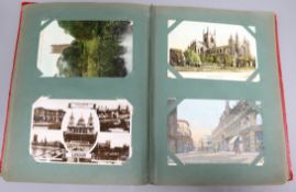 A collection of postcards and three postcard albums