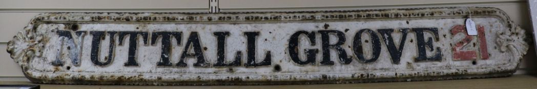 A cast iron street sign for Nuttal Grove 21 length 154cm