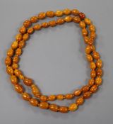 A single strand amber bead necklace, gross weight 61 grams, 98 cm.