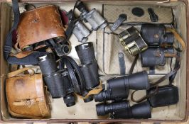 A collection of binoculars including two pairs of Zeiss Jena and a Negretti & Zambra folding Minim