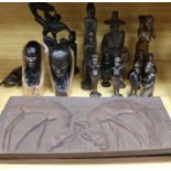 A group of African carvings and two wood plaques