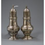 Two similar George II/III silver pepperettes/casters, John Delmester, London, 1758 and I.D London,