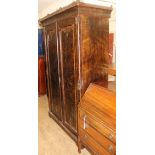 A late 19th century aesthetic movement two door wardrobe W.129cm