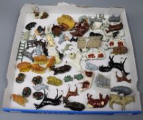 A collection of Britains farmyard animals, cows, sheep and haystacks, etc.