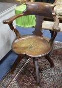 An Edwardian oak desk chair