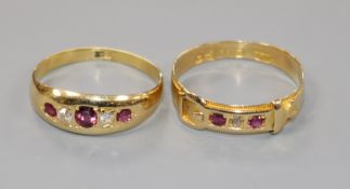 Two 18ct gold, ruby and diamond set rings, including a late Victorian buckle ring.