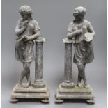 A pair of weathered spelter figures height 38cm
