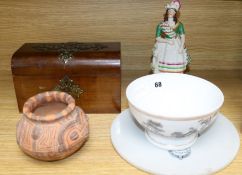 A Staffordshire figure, a circular plaque, a terracotta pot, a ceramic bowl and a tea caddy