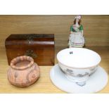 A Staffordshire figure, a circular plaque, a terracotta pot, a ceramic bowl and a tea caddy