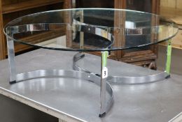 A 1970's Merrow Associates circular glass and chrome based coffee table, designed by Richard Young