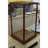 An oak-framed plate glass glazed display cabinet